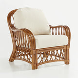 Antigua armchair in Walnut rattan with cream seat and back cushions and layered pole arms
