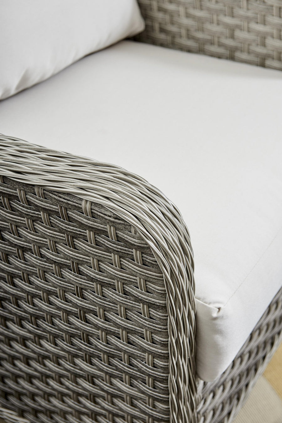 Close view of handwoven Pebble wicker on a Mayfair arm