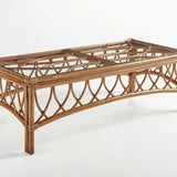 Antigua coffee table in Walnut rattan with a glass top over a two panel frame and arched sides